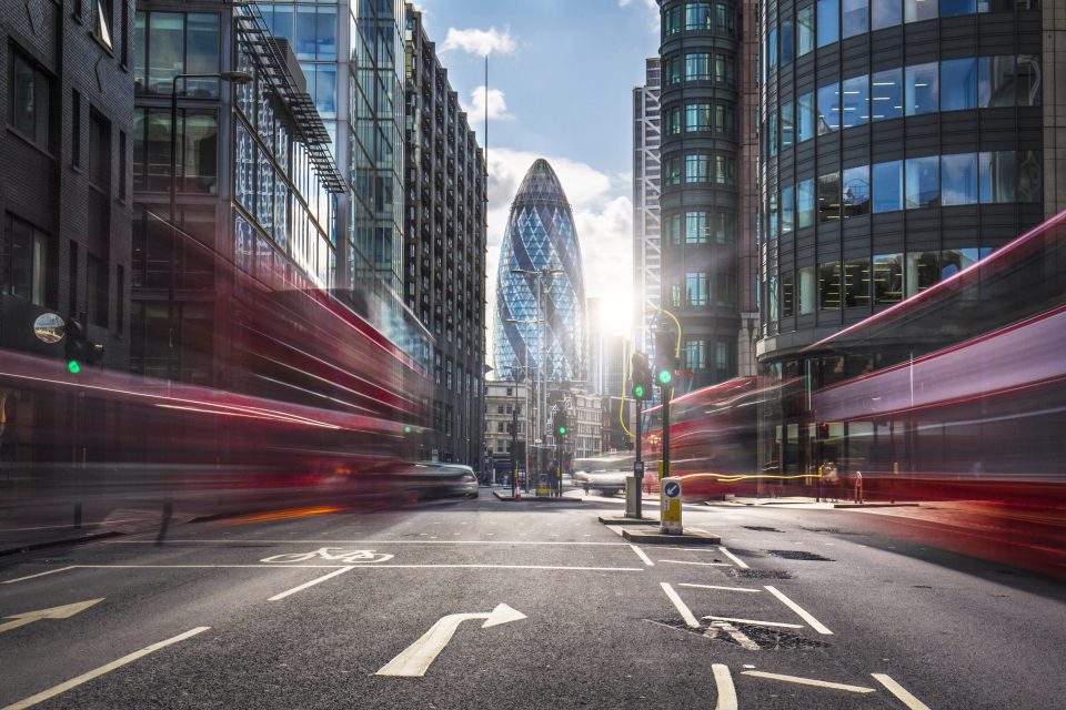 Buses on the street at the financial district of London.